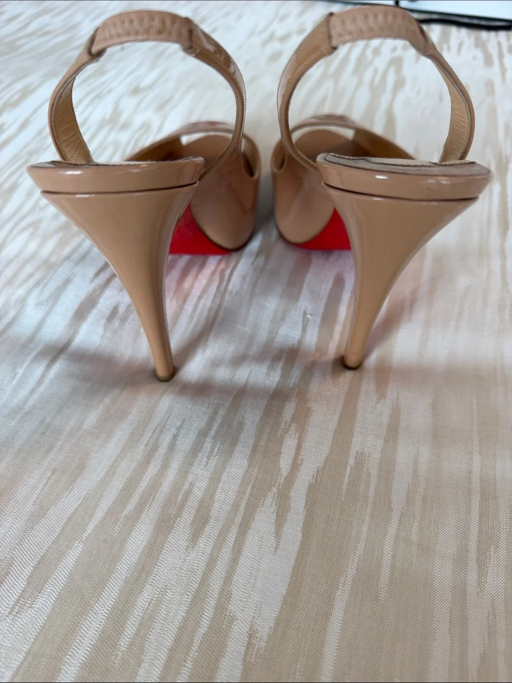 Christian Louboutin glossy beige